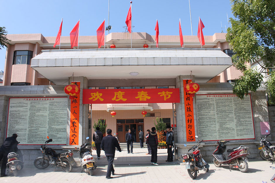 On the eve of the Chinese New Year, couplets (ceremonial banners) are posted outside the Village Party Committee office. The couplets were contributed by a netizen and calligraphed by protest leader Yang Semao. The translation reads: “Small village starts self-governance with great happiness showing in our eyes, tomorrow will be determined by 'one person, one vote' while spring is coming back to Wukan.”